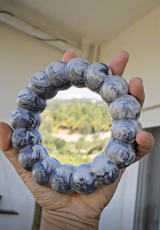 Round mirror framed with marbled blue resin beads