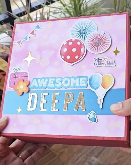 Handmade gift box decorated with the name Deepa, balloons and bunting