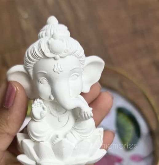 Unpainted Bal Ganesh idol on a lotus base