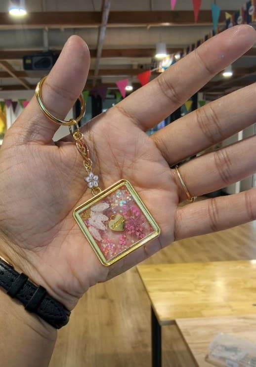 Square resin pendant with real pressed flowers on a gold chain